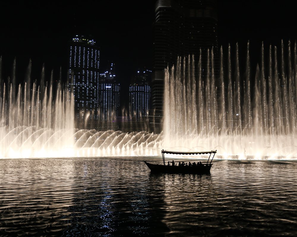 The fountain on Burj Khalifa Lake lit up at night